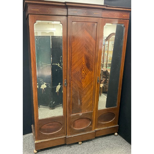 240 - A Victorian mahogany compactum wardrobe, break-centre front, with inlaid centre panel, flanked by pa... 