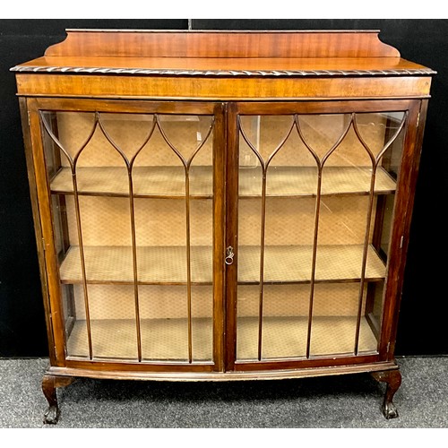 186A - An early 20th century mahogany bow-front china display cabinet, 129.5cm high x 120.5cm wide x 38.5cm... 