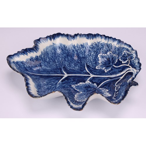 48A - A large Bow leaf shaped dish, painted in dark blue with vine, 19.5cm wide, pseudo-Chinese four-chara... 