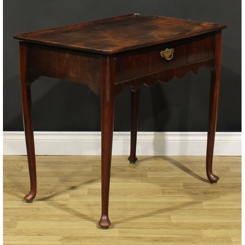 1235A - A George II mahogany silver table, dished rounded rectangular top above a long frieze drawer, shaped... 