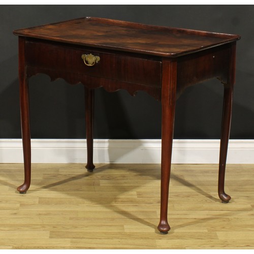 1235A - A George II mahogany silver table, dished rounded rectangular top above a long frieze drawer, shaped... 