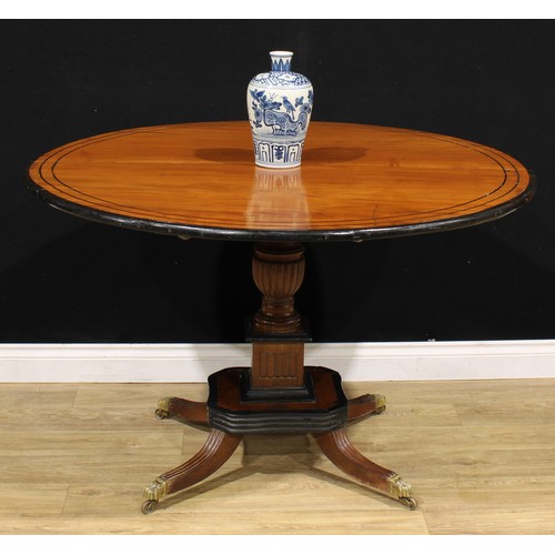 1317A - A 19th century Indo-Dutch jackfruit and ebonised centre table, circular tilting top turned and flute... 