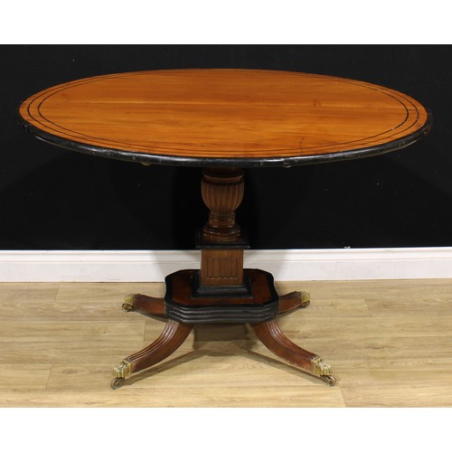 1317A - A 19th century Indo-Dutch jackfruit and ebonised centre table, circular tilting top turned and flute... 