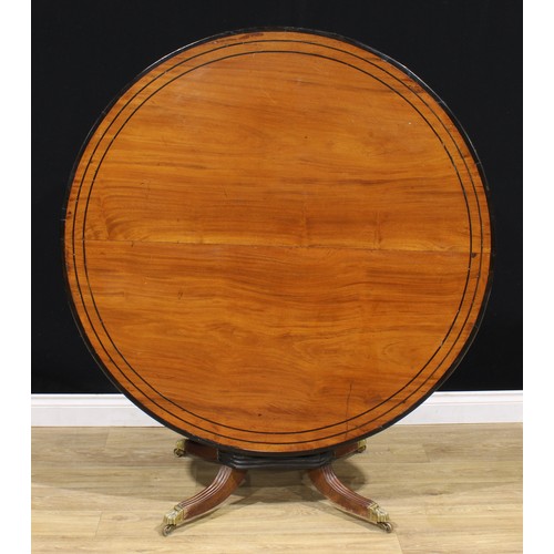 1317A - A 19th century Indo-Dutch jackfruit and ebonised centre table, circular tilting top turned and flute... 