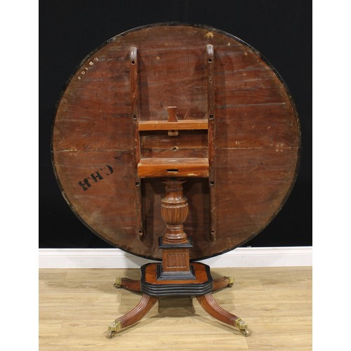 1317A - A 19th century Indo-Dutch jackfruit and ebonised centre table, circular tilting top turned and flute... 