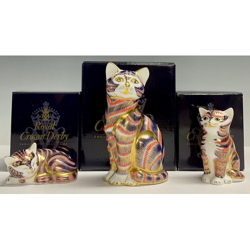 3 - A Royal Crown Derby paperweights, Cat, gold stopper, 13cm tall, boxed; two others, Sitting Kitten an... 