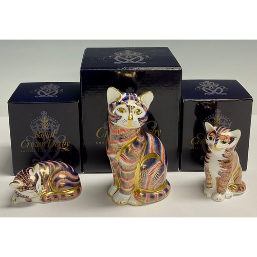 3 - A Royal Crown Derby paperweights, Cat, gold stopper, 13cm tall, boxed; two others, Sitting Kitten an... 