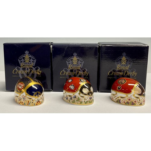 10 - A Royal Crown Derby Paperweight, Red Ladybird, with two spots, another with seven spots; and a Blue ... 