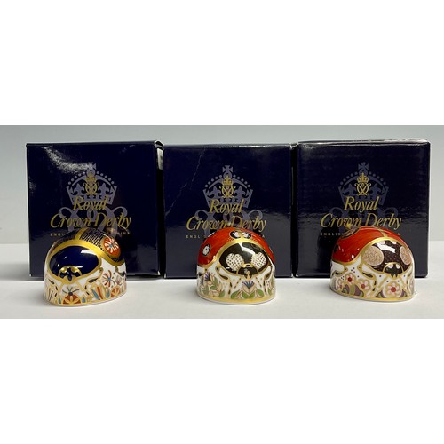 10 - A Royal Crown Derby Paperweight, Red Ladybird, with two spots, another with seven spots; and a Blue ... 