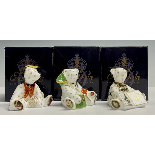 13 - A Royal Crown Derby miniature shopper bear, Graduate, 7cm high; two others, Gone Fishing, 6cm high a... 