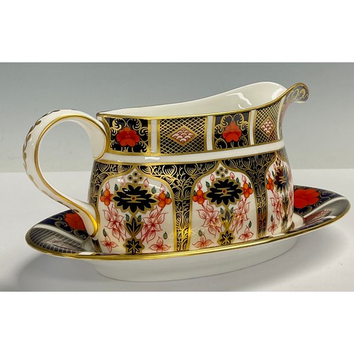 19 - A Royal Crown Derby Imari 1128 pattern sauce boat on stand, 21cm wide, printed mark, first quality