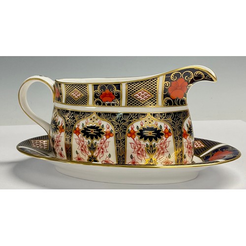 19 - A Royal Crown Derby Imari 1128 pattern sauce boat on stand, 21cm wide, printed mark, first quality