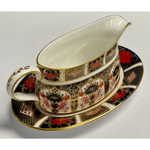 19 - A Royal Crown Derby Imari 1128 pattern sauce boat on stand, 21cm wide, printed mark, first quality