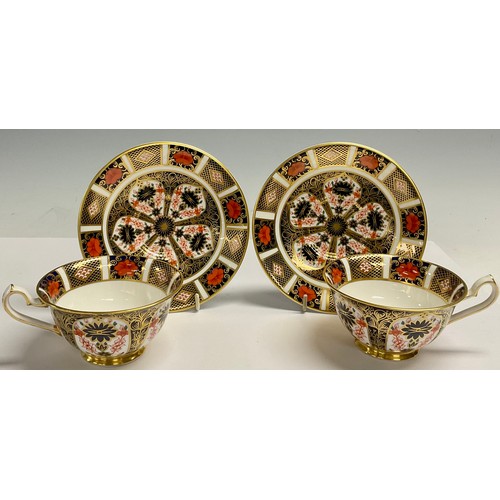 25 - A pair of Royal Crown Derby Imari 1128 pattern tea cups and saucers, printed marks, first quality