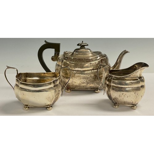 52 - A George V silver three piece boat shaped tea service, Chester 1929, 23ozt