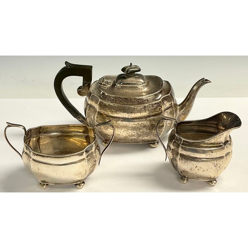 52 - A George V silver three piece boat shaped tea service, Chester 1929, 23ozt