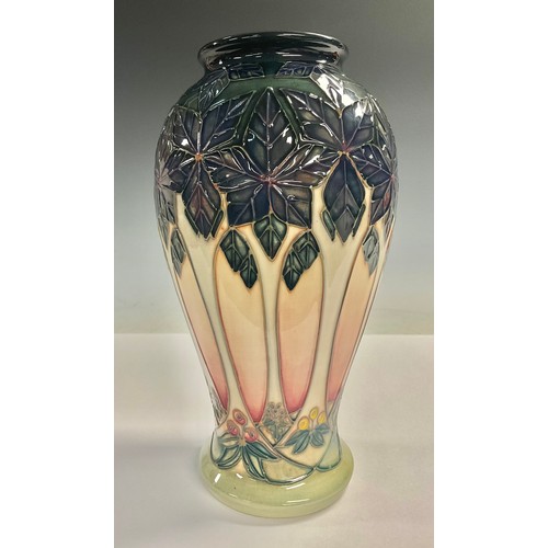 66 - A Moorcroft Cluny pattern inverted baluster vase, tube lined with tall trees, 27cm, impressed and pa... 