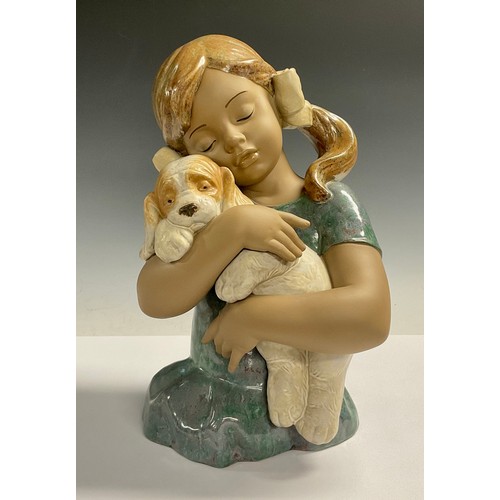 70 - A large Lladro figure group, Gabriela, young girl with sleepy puppy in her arms, glazed in muted ton... 