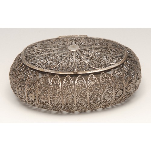 142 - A Continental silver coloured metal oval box, possibly Maltese, hinged cover, 8cm wide