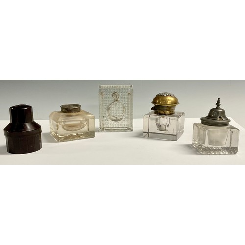 145 - A large Victorian inkwell, armorial top; Stephens ink bottle, bakelite case; three other inkwells (5... 