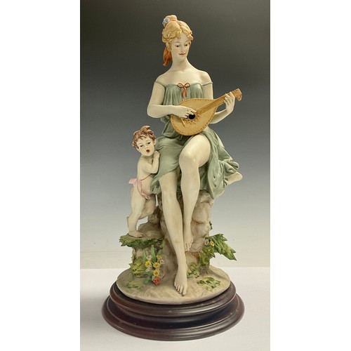 78 - An Italian Naples figure, signed Benacchio, The Lute Player, scantily clad lady with putto companion... 