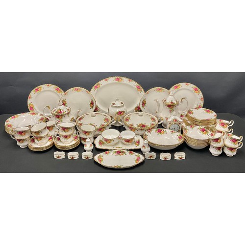 91 - A Royal Albert Old Country Roses pattern dinner and tea service including teapot, milk jug and sugar... 