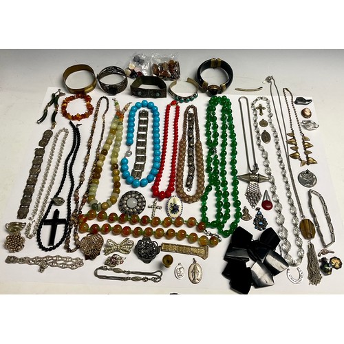 196 - A strand of quartz polished beads; other bead necklaces; a bangle; other bracelets and bangles; ambe... 