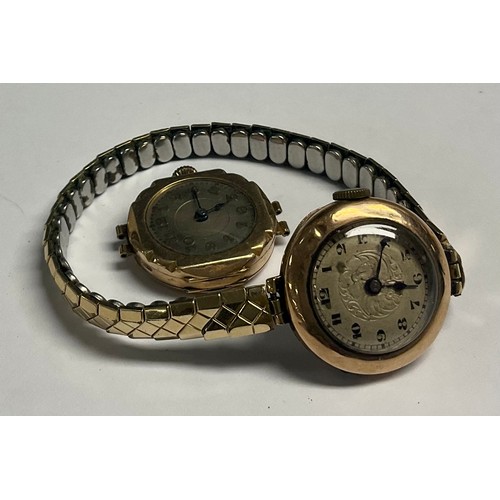 215 - A lady's 9ct rose gold watch, Arabic numerals, later metal expanding bracelet strap; another similar... 