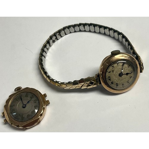 215 - A lady's 9ct rose gold watch, Arabic numerals, later metal expanding bracelet strap; another similar... 