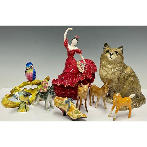 176 - A Beswick cat, no 1867; a Coalport figure, Flamenco, no. 1053, limited edition of 9,500; a Staffords... 