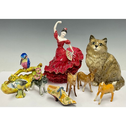 176 - A Beswick cat, no 1867; a Coalport figure, Flamenco, no. 1053, limited edition of 9,500; a Staffords... 