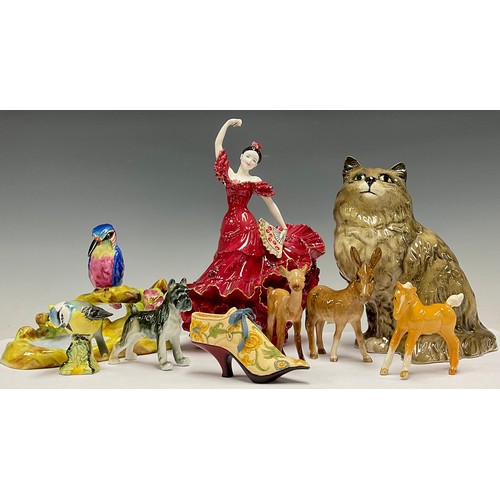 176 - A Beswick cat, no 1867; a Coalport figure, Flamenco, no. 1053, limited edition of 9,500; a Staffords... 