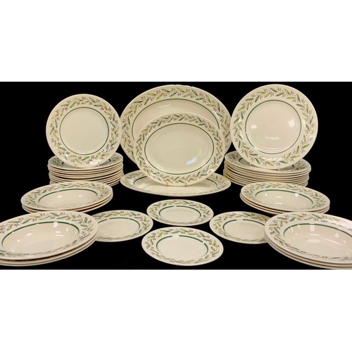 63 - A Royal Doulton ‘Almond Willow’ pattern dinner service for six including; ten dinner plates, twelve ... 