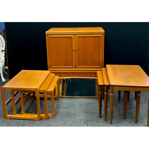 89 - A G-plan style teak nest of three tables;  a mid-century design teak wall mirror;  side cabinet, etc... 