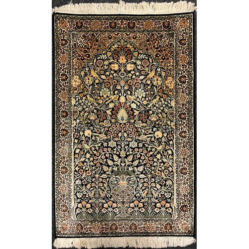 95 - A Kashmiri Tree of Life silk rug / carpet, 124cm x 77.5cm.