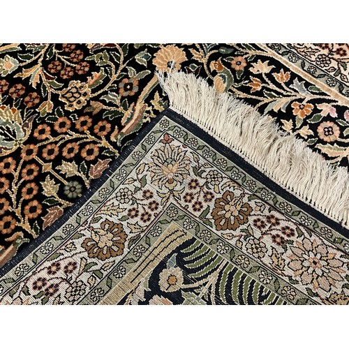 95 - A Kashmiri Tree of Life silk rug / carpet, 124cm x 77.5cm.