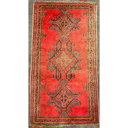 99 - A Turkish Ushak type hand-knotted woollen rug / carpet, 181cm x 93cm;  and a Lori-Bakhtiari type woo... 