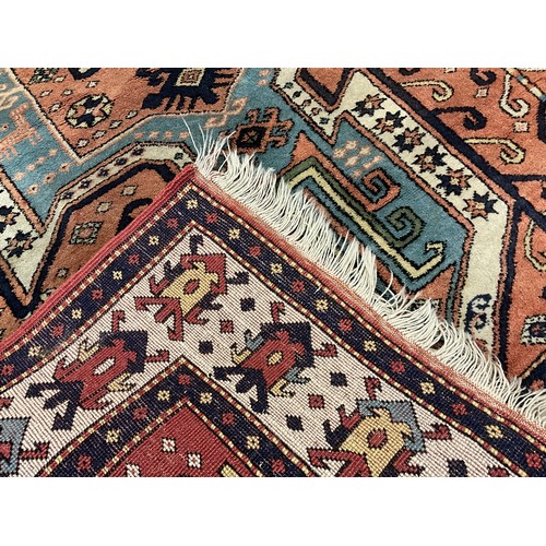 100 - A Middle Eastern style Woollen rug / carpet, 161cm x 123cm.