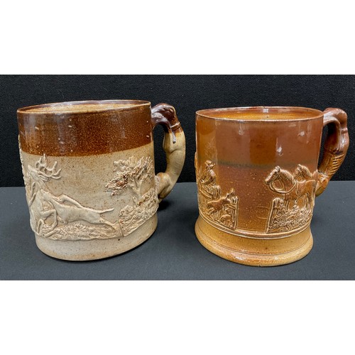 104 - 19th century stoneware Derbyshire salt glazed mugs / tankards, applied in relief with hounds, greyho... 