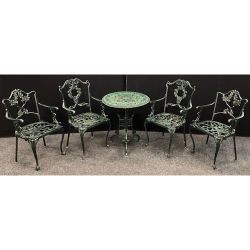 114 - A Cast iron/metal bistro set, painted green, comprising circular pedestall tripod table, with psir o... 