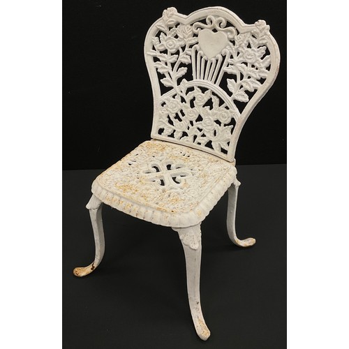 122 - A child’s Victorian cast iron garden chair, 42cm high x 23.5cm wide x 21.5cm deep.