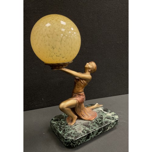 128 - An art deco lamp, figure of a woman holding up a mottled globular shade, marble plinth, 30cm high