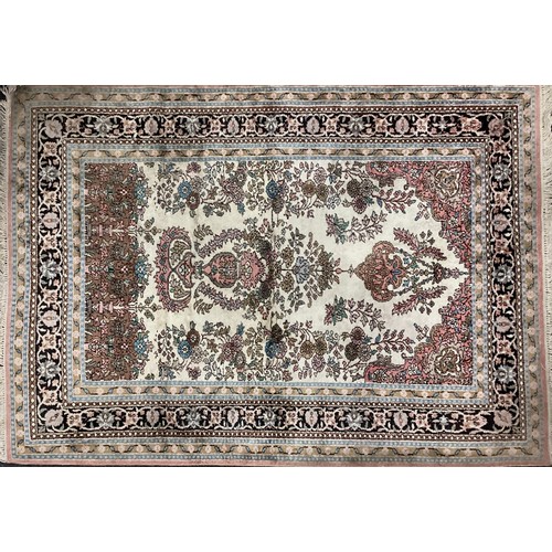 132 - A Persian Kashan silk carpet / rug, knotted with a central field as a stylised floral arbor and vase... 