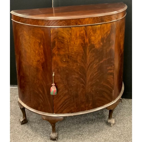 141 - A 19th century style mahogany Demi-lune hall cabinet, having a single large bow-shaped door to centr... 