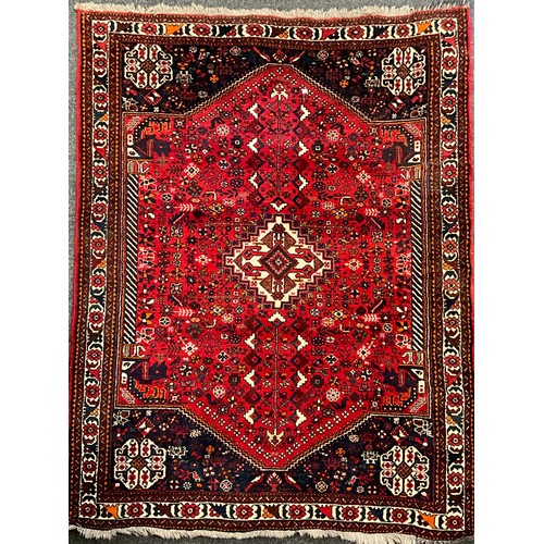 143 - A mid 20th century Persian Shiraz type rug / carpet, hand-knotted with central diamond shaped medall... 