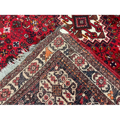 143 - A mid 20th century Persian Shiraz type rug / carpet, hand-knotted with central diamond shaped medall... 