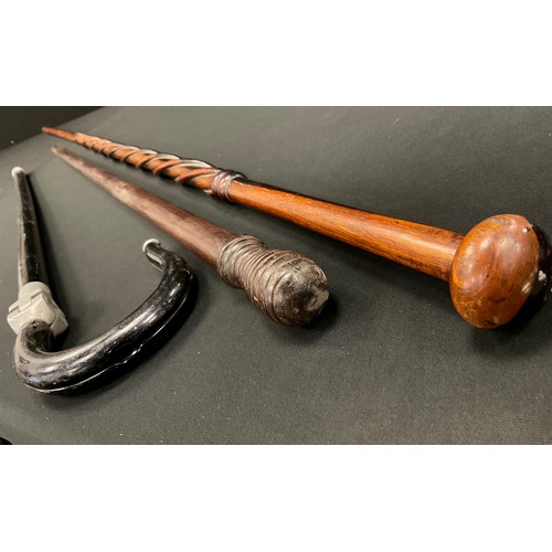 185 - A late 19th century cane, ring turned pommel. 92cm high;  an ebonised shooting stick;  a wrythen can... 