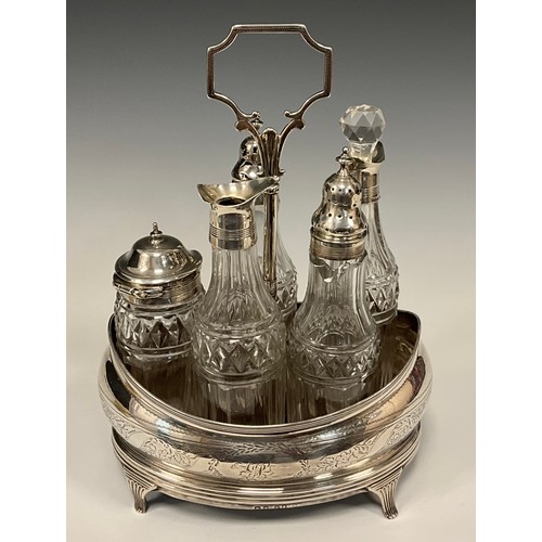 188 - A George IV silver five bottle cruet stand, boat shaped stand, central carrying handle, with five cu... 