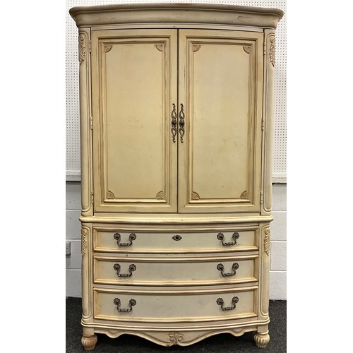 139 - A French style reproduction wardrobe, having a pair of doors, above three long drawers, 187.5cm high... 