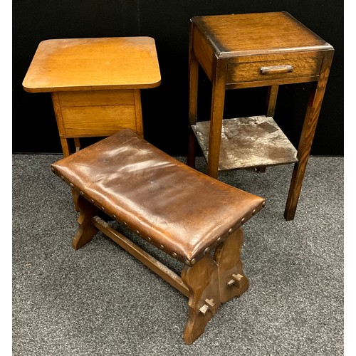 135 - An oak Arts-and-crafts style leather seated stool;  mid century oak work table;  oak lamp table, (3)... 